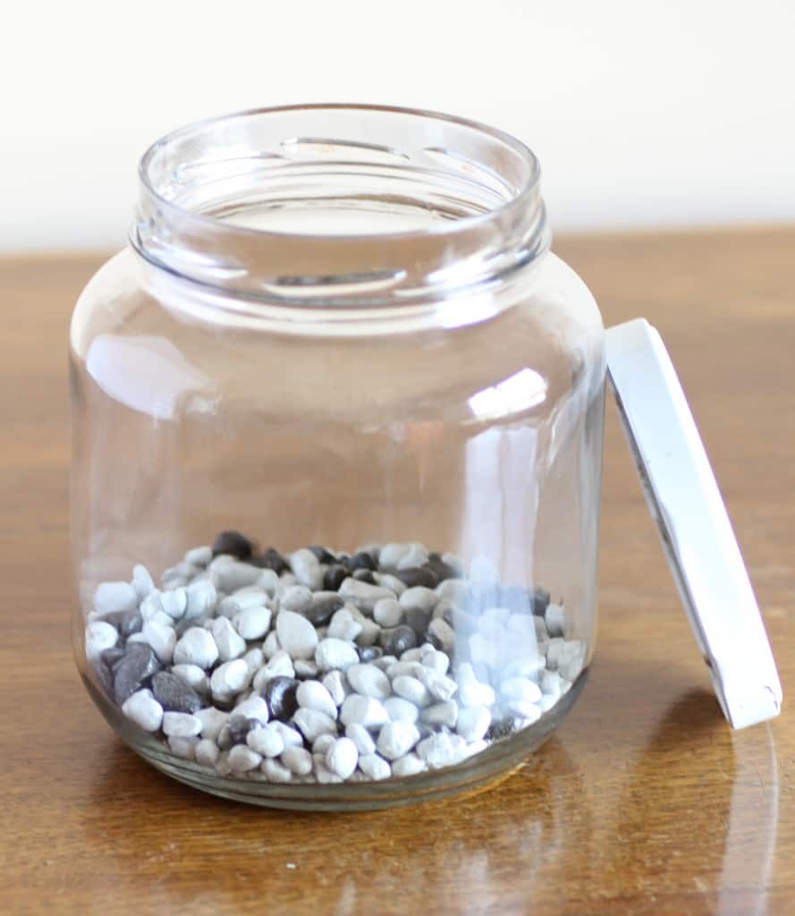 Line the bottom with decorative rocks
