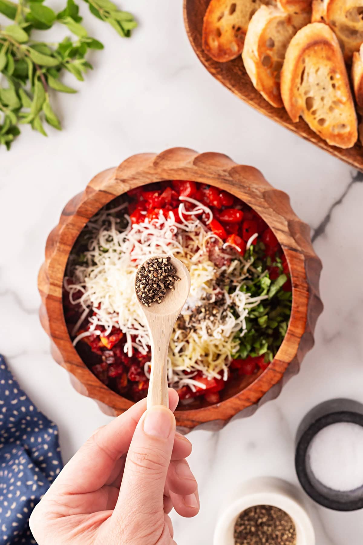 This Best Tomato Bruschetta recipe will have you making it all year round. The flavors are perfectly balanced and one that I get rave reviews from. Adding pepper.