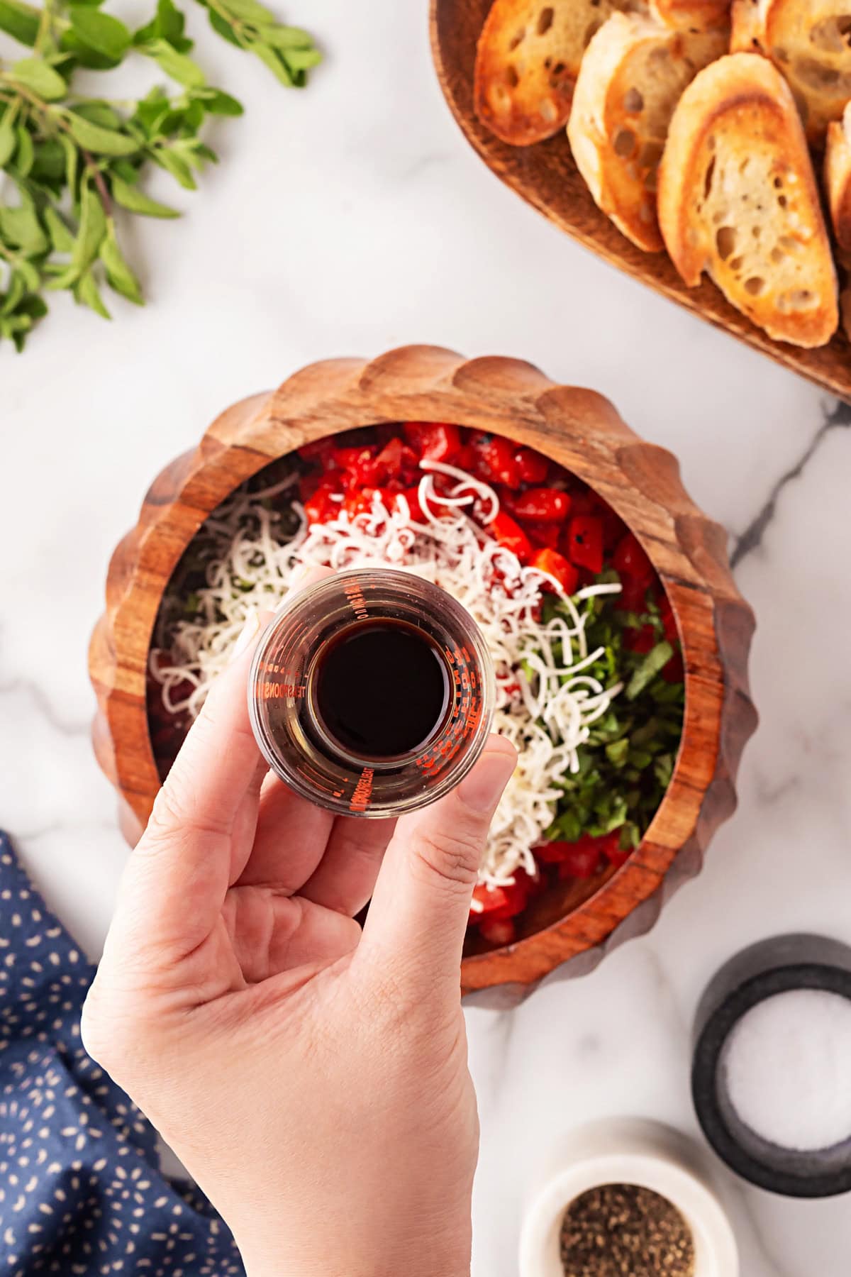 This Best Tomato Bruschetta recipe will have you making it all year round. The flavors are perfectly balanced and one that I get rave reviews from. Adding balsamic vinegar.
