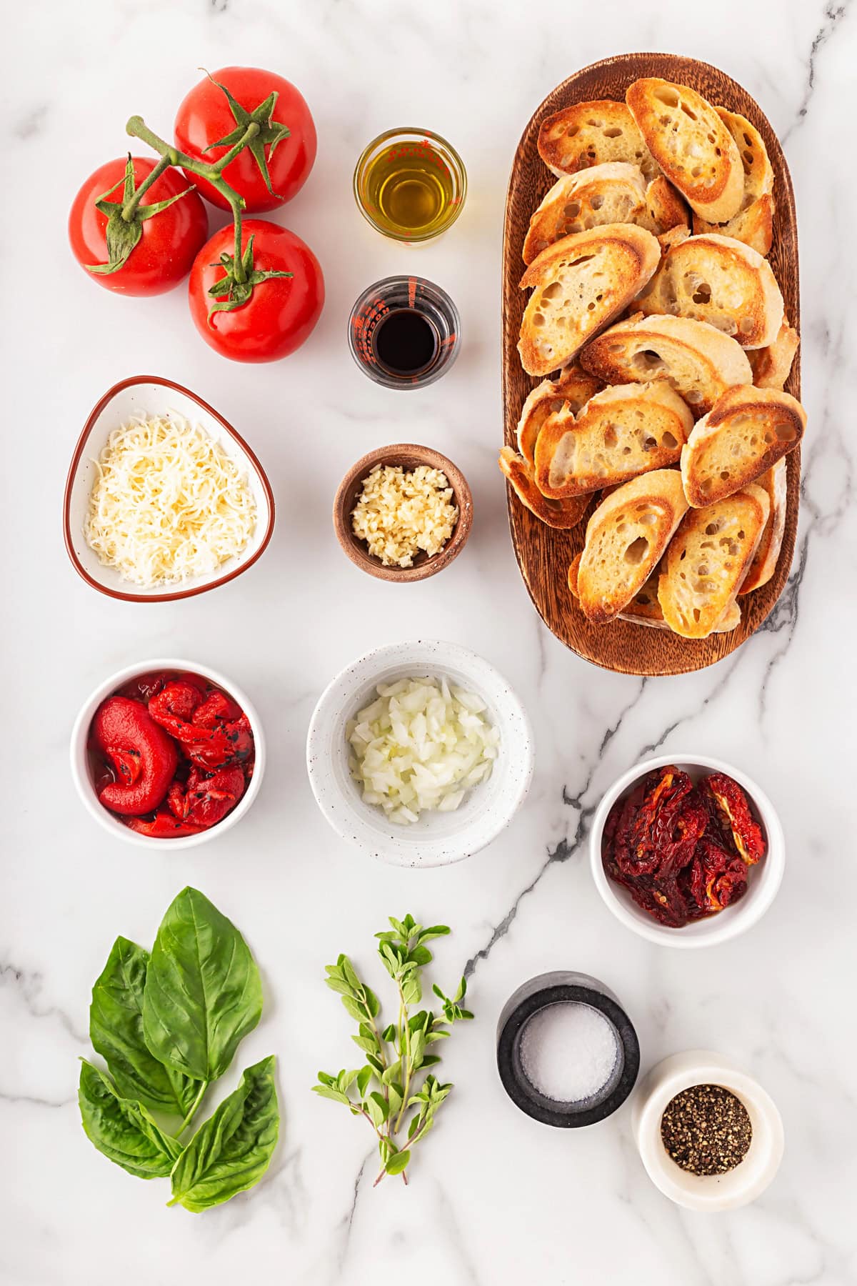 This Best Tomato Bruschetta recipe will have you making it all year round. The flavors are perfectly balanced and one that I get rave reviews from. Ingredients for Tomato Bruschetta.