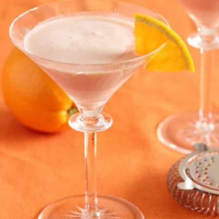 creamsicle cocktail in a martini glass