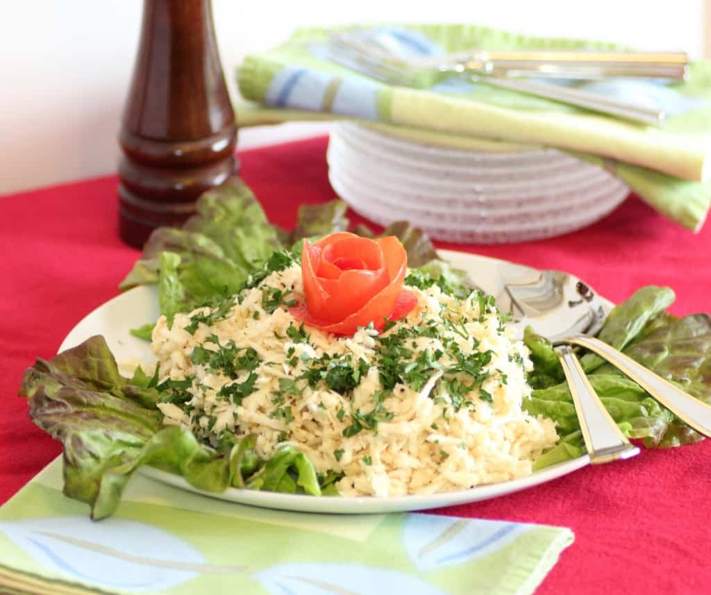 Celery Root Remoulade served on a white green lettuce leave under it