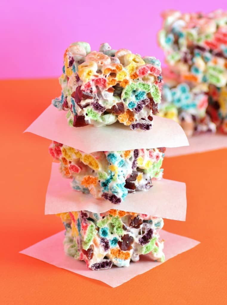 3 Fruit loop squares stacked on top of each other with wax paper in between
