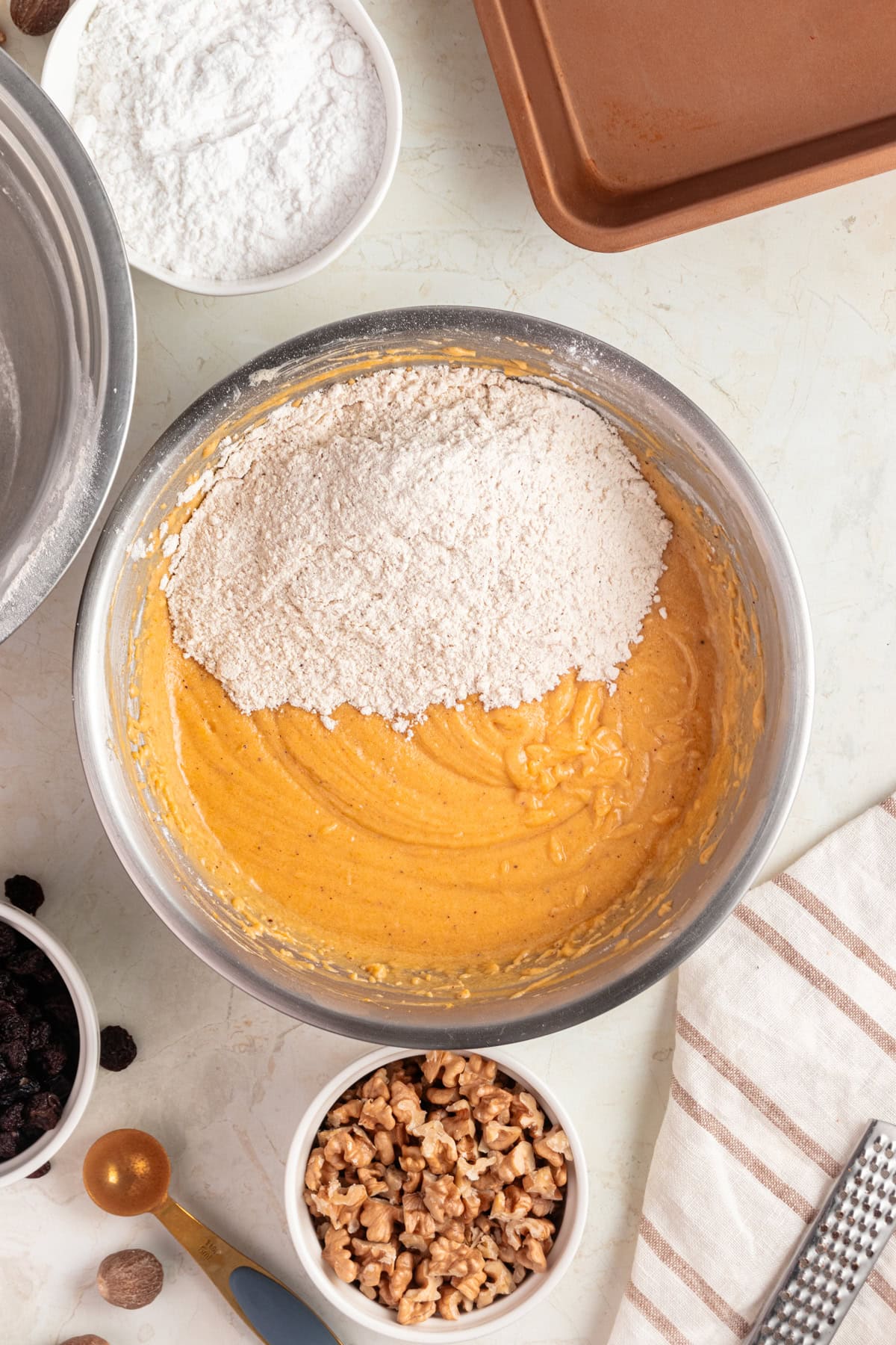 Incorporating flour to the pumpkin mixture.