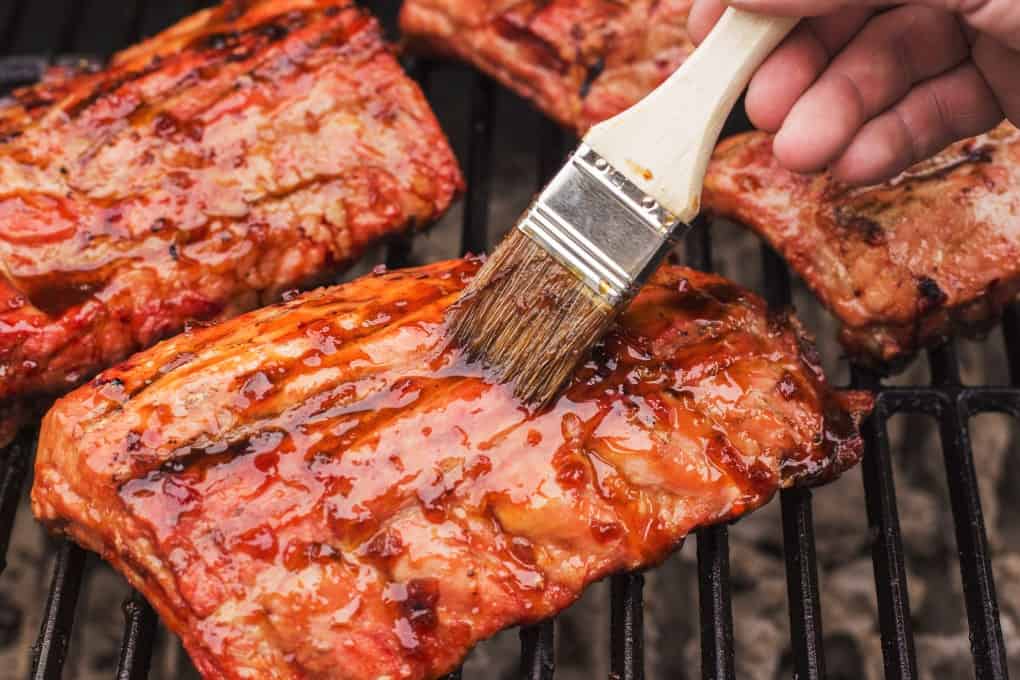 Ribs on the BBQ being glazed