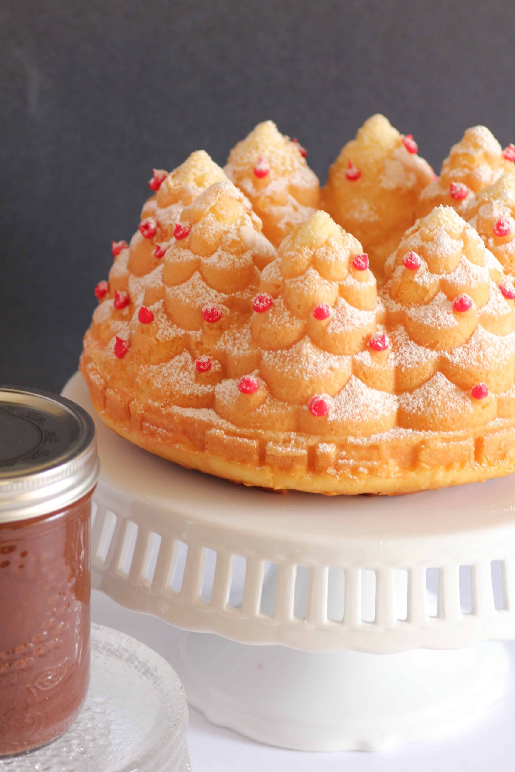 Holiday tree cake with a jar of mint chocolate sauce.