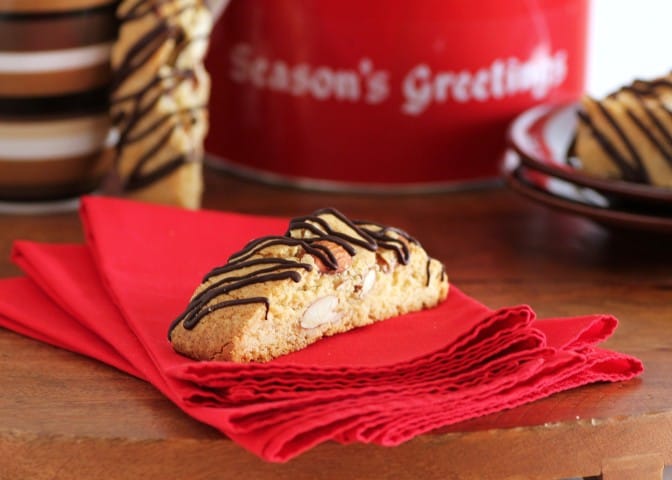 1 piece of Amaretto Almond Biscotti on a stack of red napkins