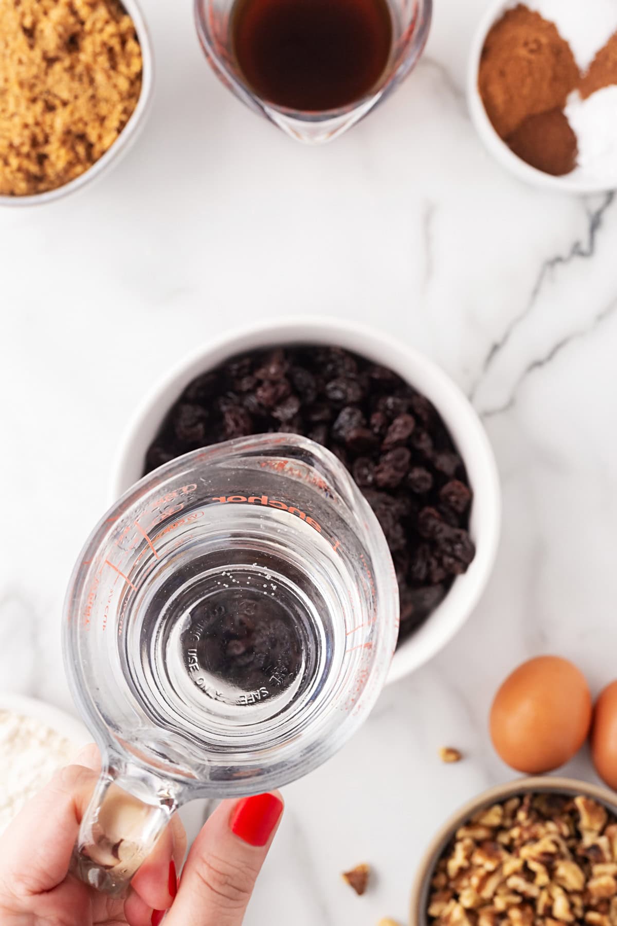 Adding water to raisins.