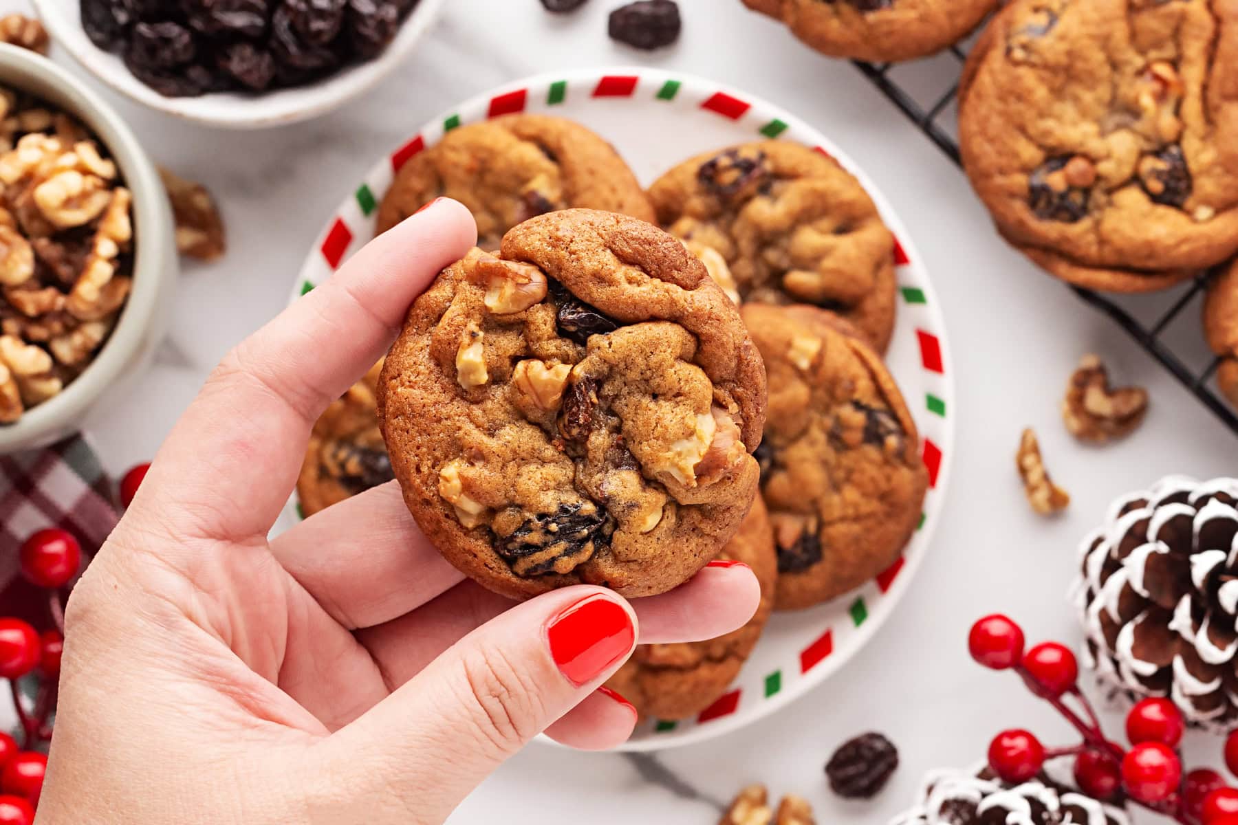 Holding a cookie. 