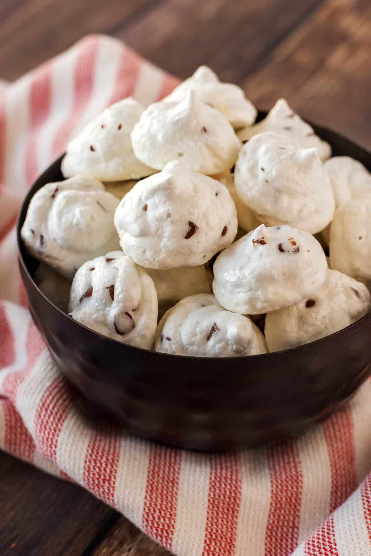 Mini Chocolate Chip Meringue Cookies in a small black bowl.