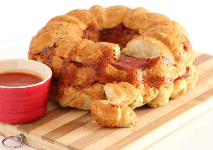 Pepperoni and Mozzarella Pull Apart on a wooden board with tomato dippping sauce