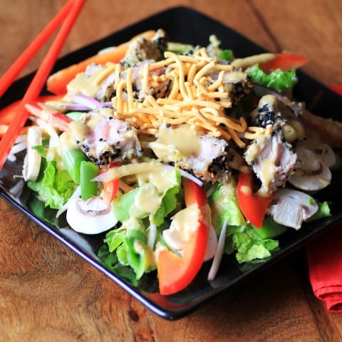 Ahi Tuna Salad on a black plate with chop sticks