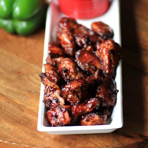 Cherry Chipotle Wings on a white prectangle platter