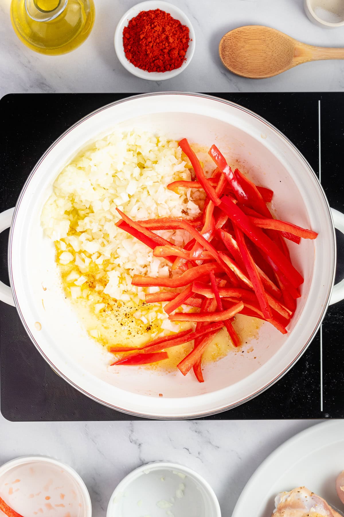 Sauté onion and red bell pepper in olive oil.