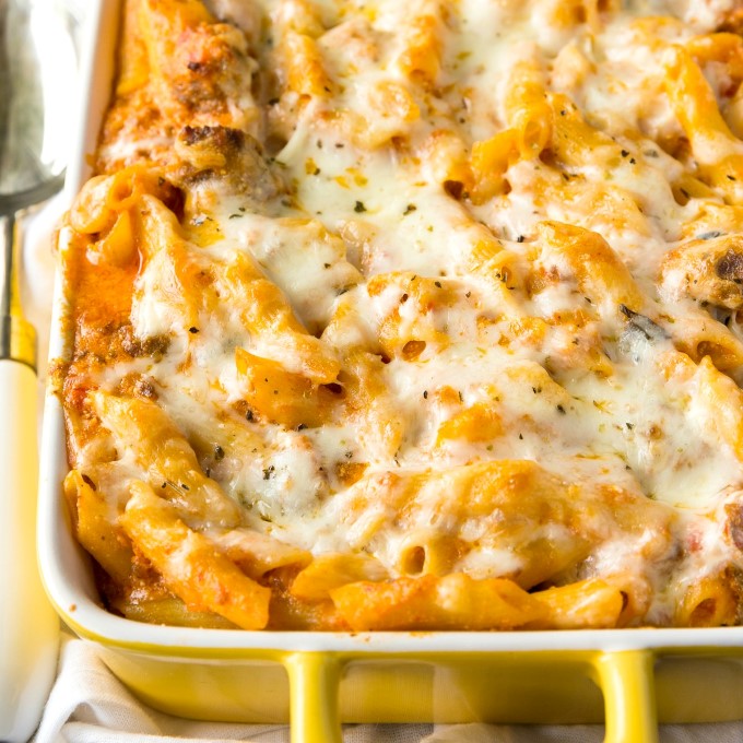 Penne a la vodka in a yellow and white casserole dish