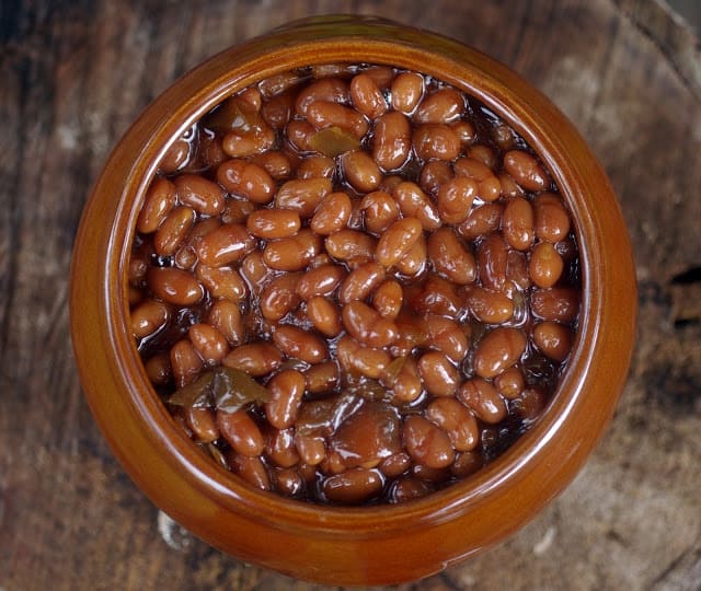 Baked Beans in a large brown ceramic bowl