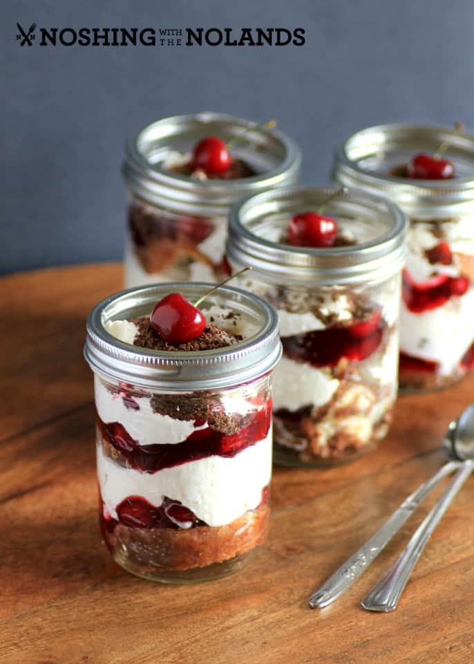 Black Forest Surprise in mason jars on a wooden board