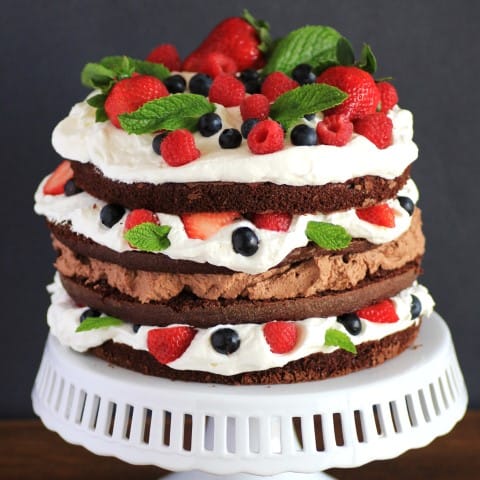Whipped Cream Berry Layer Cake on a white cake stand