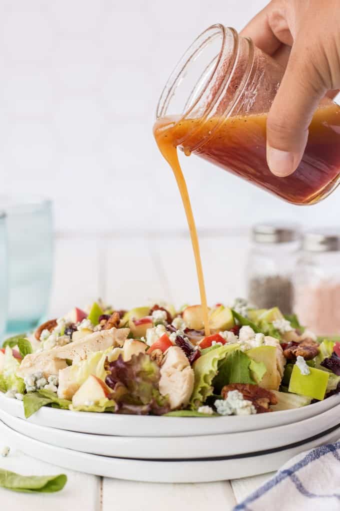 Pouring dressing on salad