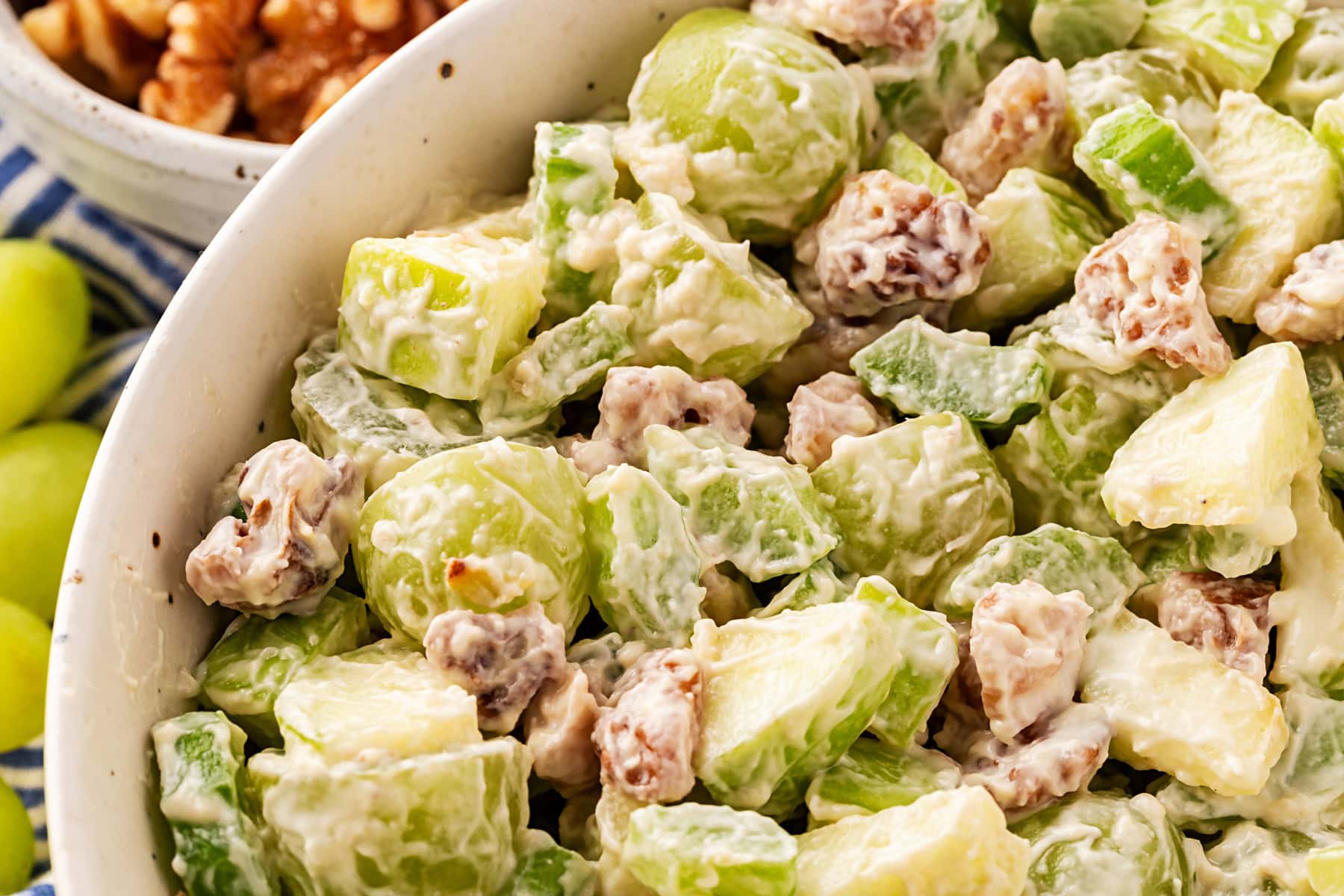 This classic salad has been enjoyed for at least 100 years. Waldorf Salad is simple to make with only 5 main ingredients and 5 minutes of your time. It is a favorite of mine for lunch. Horizontal, close-up.