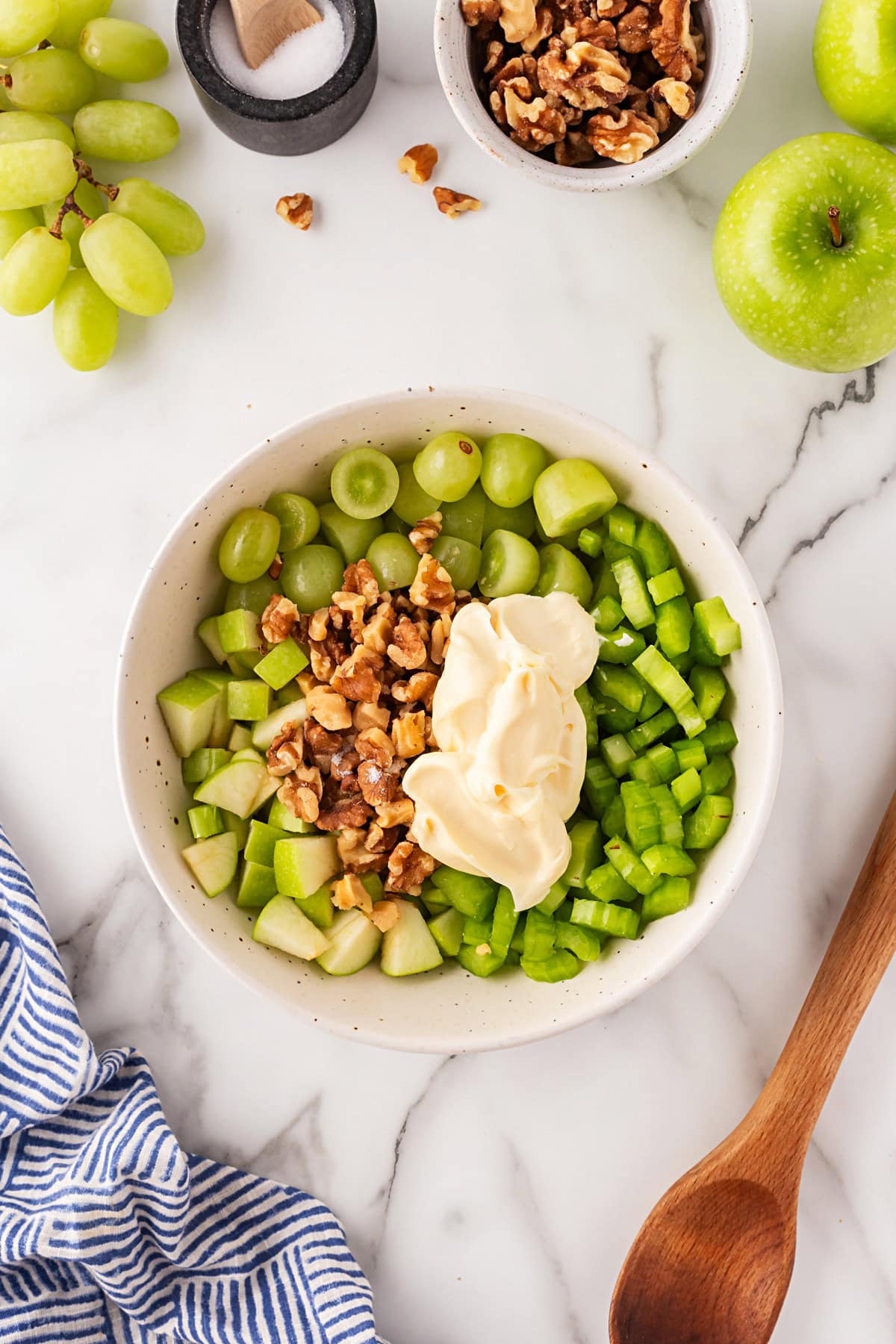 This classic salad has been enjoyed for at least 100 years. Waldorf Salad is simple to make with only 5 main ingredients and 5 minutes of your time. It is a favorite of mine for lunch. Mayo and walnuts added.