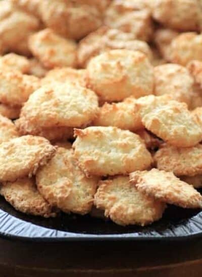 Golden Coconut Macaroon cookies stacked on a serving platter