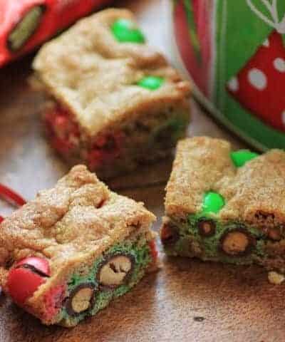 Holiday Cookie Bars cut and sitting on a wooden board