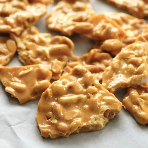 Peanut Brittle pieces on a sheet of wax paper