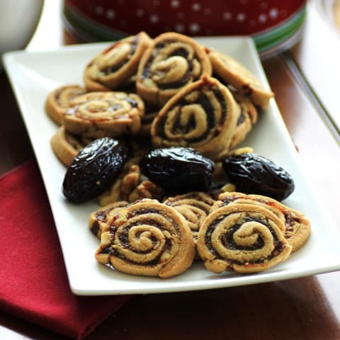 Swirl Cookies on a white rectangle plate with dates