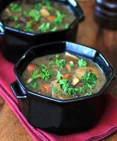 Beef Wine and mushroom soup served in black bowls