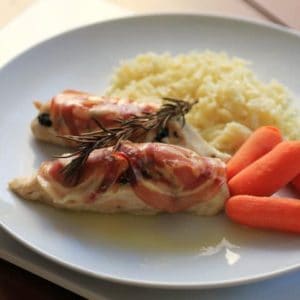 Chicken breast with Spinach and Ricotta on a white plate with Rice and carrots