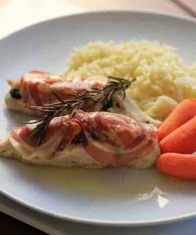 Chicken breast with Spinach and Ricotta on a white plate with Rice and carrots