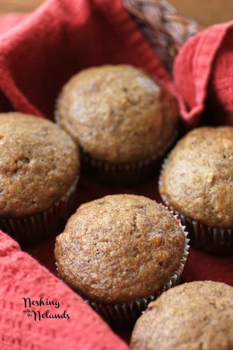 Pumpkin Pecan Muffins in a basket lined with a red cloth napkin