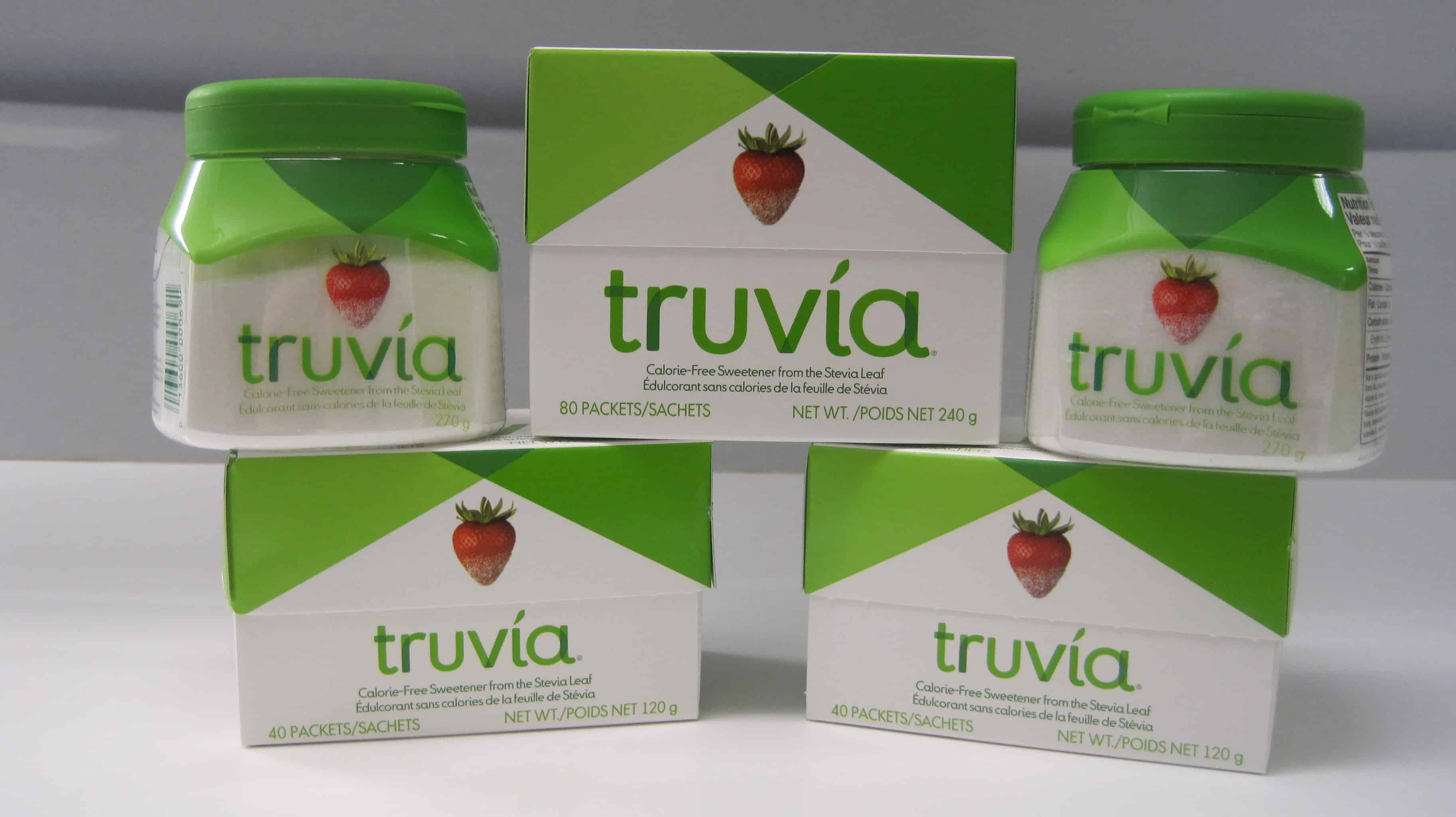 Various Truvia sweetener packages stack on a white board
