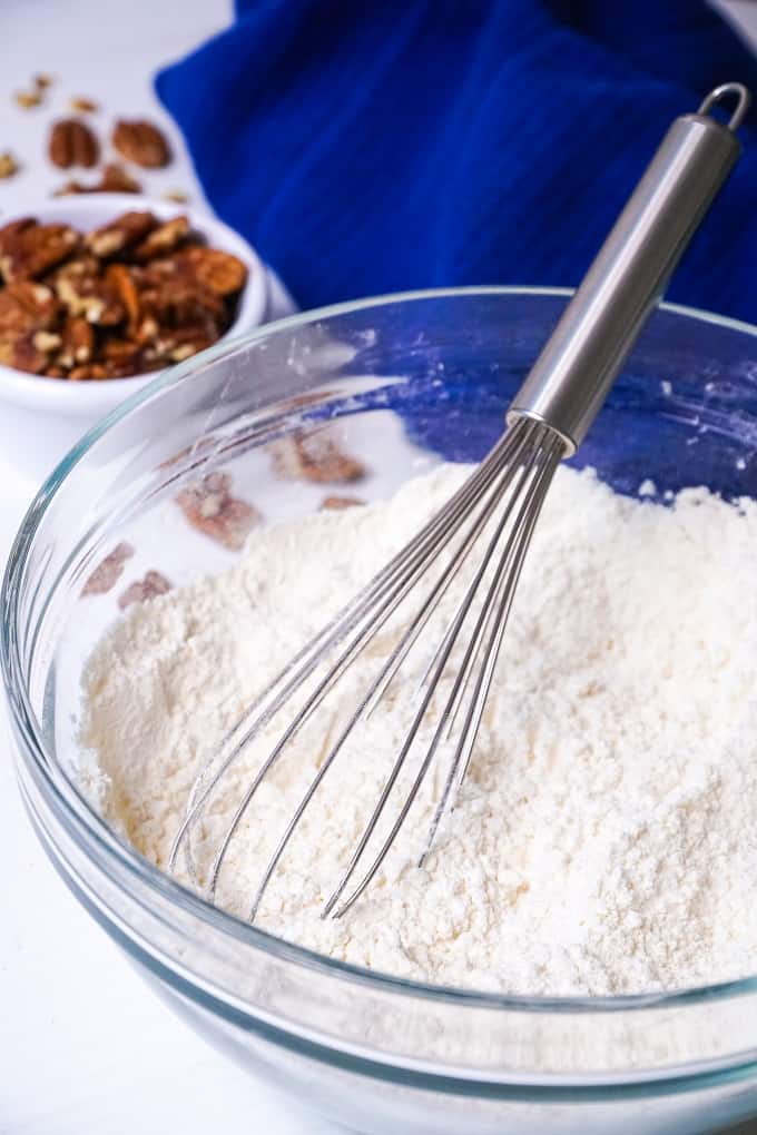 Flour in a bowl with a whisk