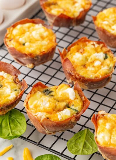 Egg cups on a cooling rack.