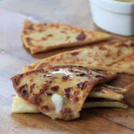Potato scones wedges covered with butter.