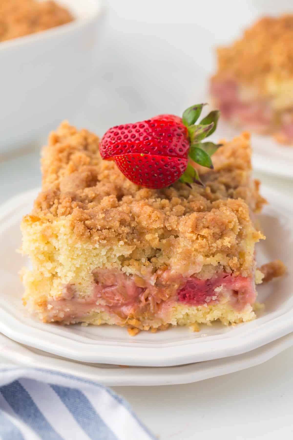 Square of Strawberry Rhubarb Cake on a plate. 
