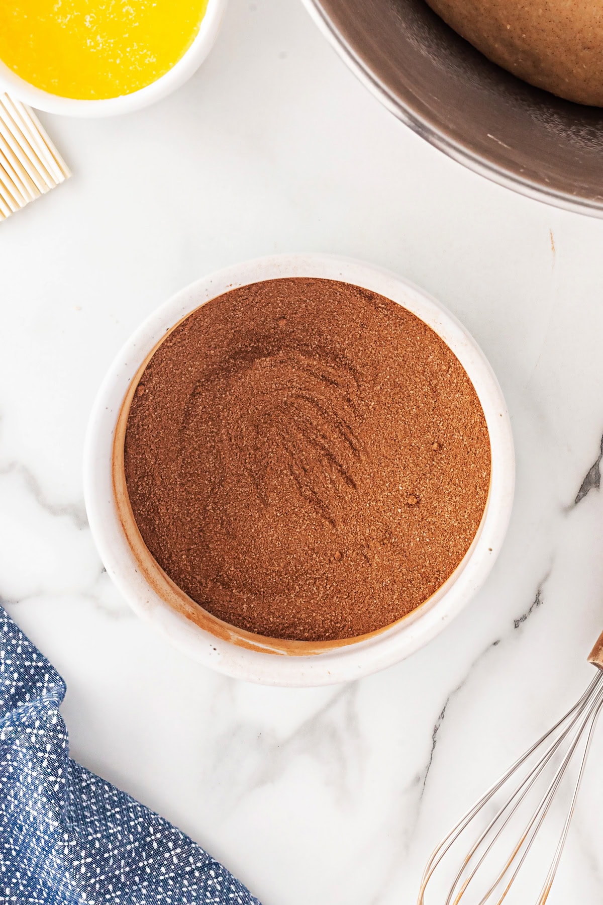 This Cinnamon Swirl Bread is one of the best homemade breads you can make. The bread is light and fluffy, with an amazing cinnamon swirl that you will be addicted to. Bowl of cinnamon sugar.