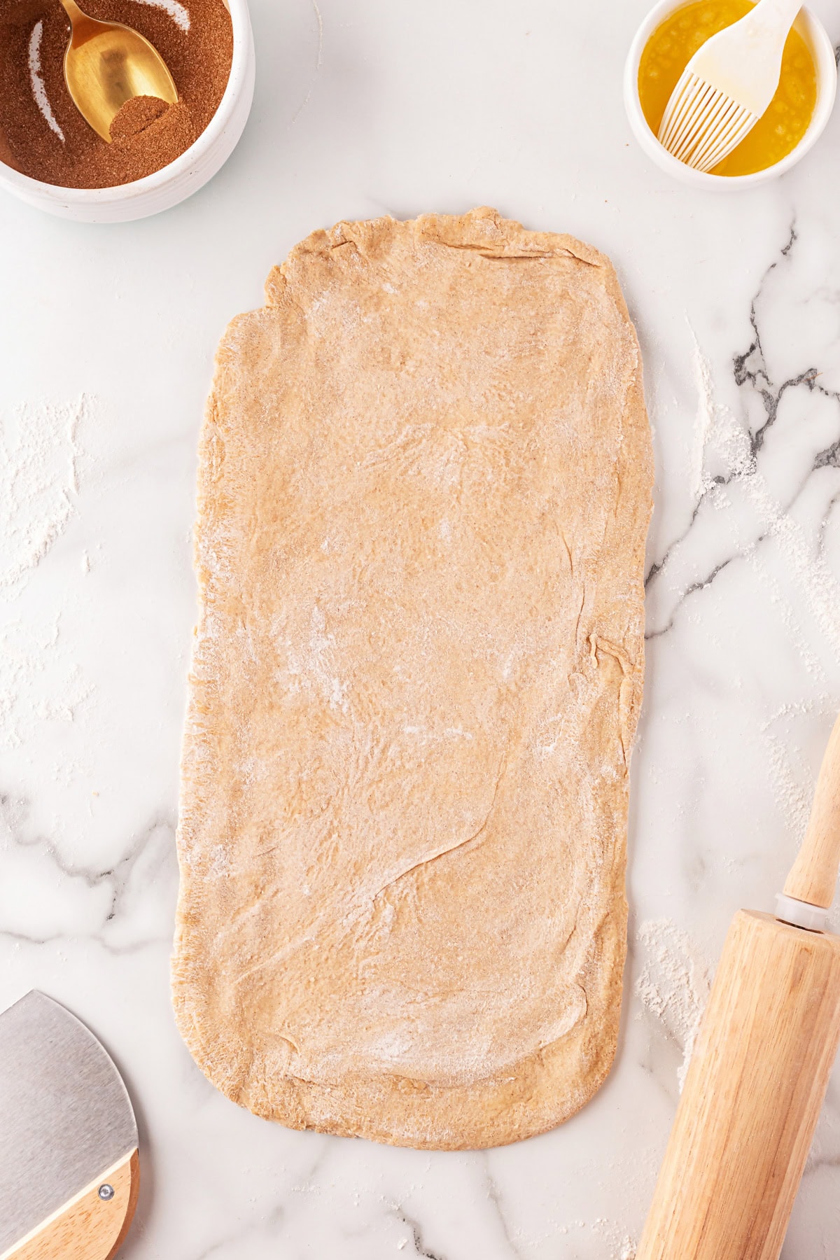 This Cinnamon Swirl Bread is one of the best homemade breads you can make. The bread is light and fluffy, with an amazing cinnamon swirl that you will be addicted to. Dough rolled in a large rectangle.