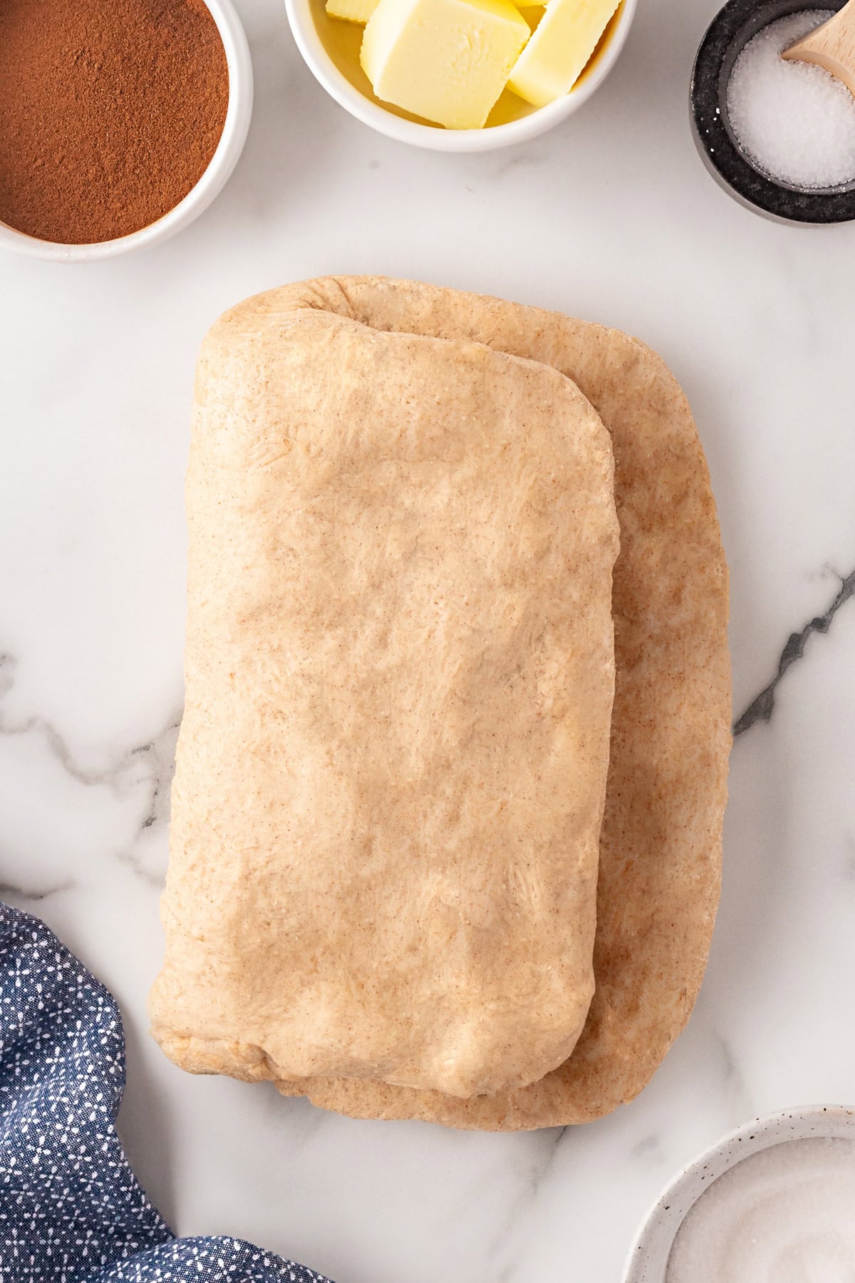 This Cinnamon Swirl Bread is one of the best homemade breads you can make. The bread is light and fluffy, with an amazing cinnamon swirl that you will be addicted to. Folded in half.