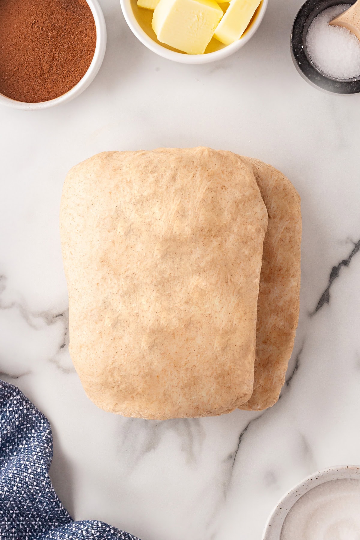 This Cinnamon Swirl Bread is one of the best homemade breads you can make. The bread is light and fluffy, with an amazing cinnamon swirl that you will be addicted to. Folded into quarter.