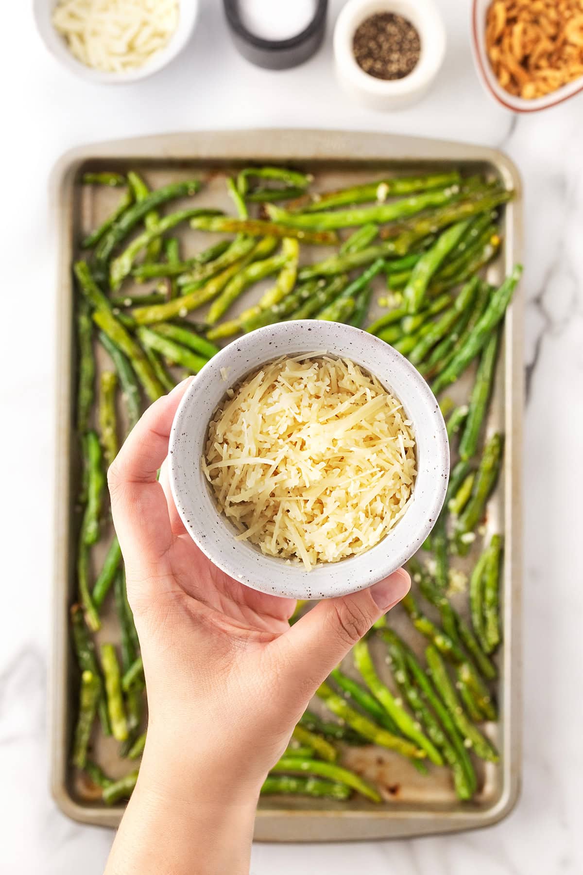 Adding Parmesan.