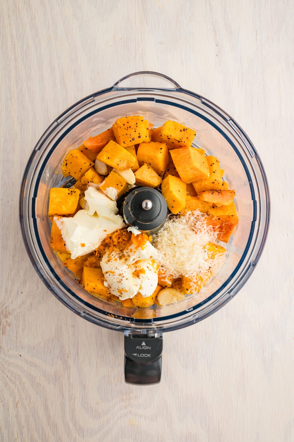 Filling ingredients in a food processor. 