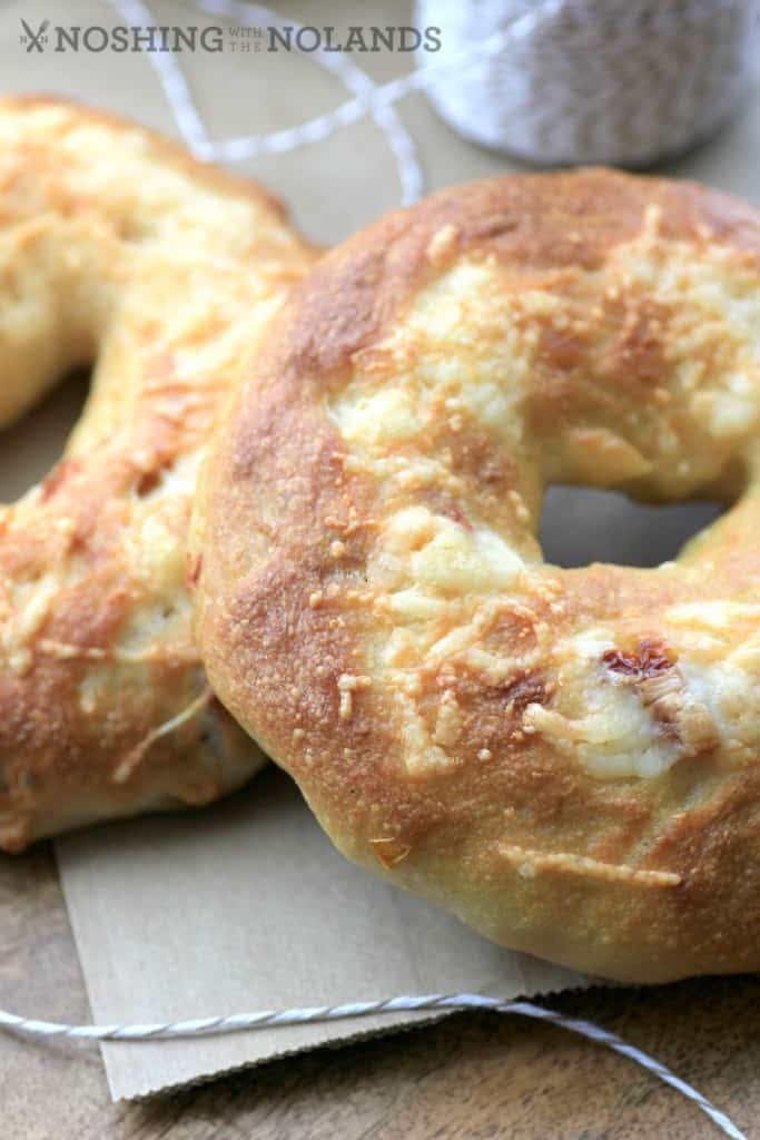 Sundried Tomato Asiago Bagels close up sitting on a paper napkin