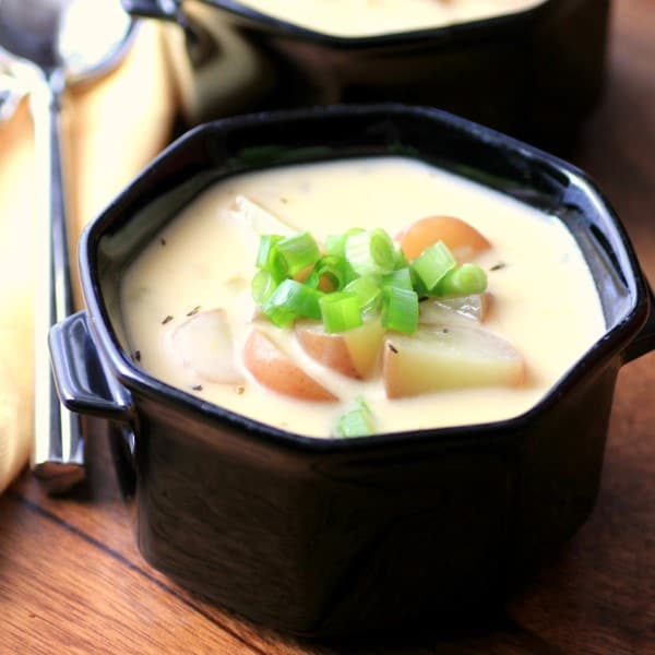 Cheesy Potato Soup in a black bowl