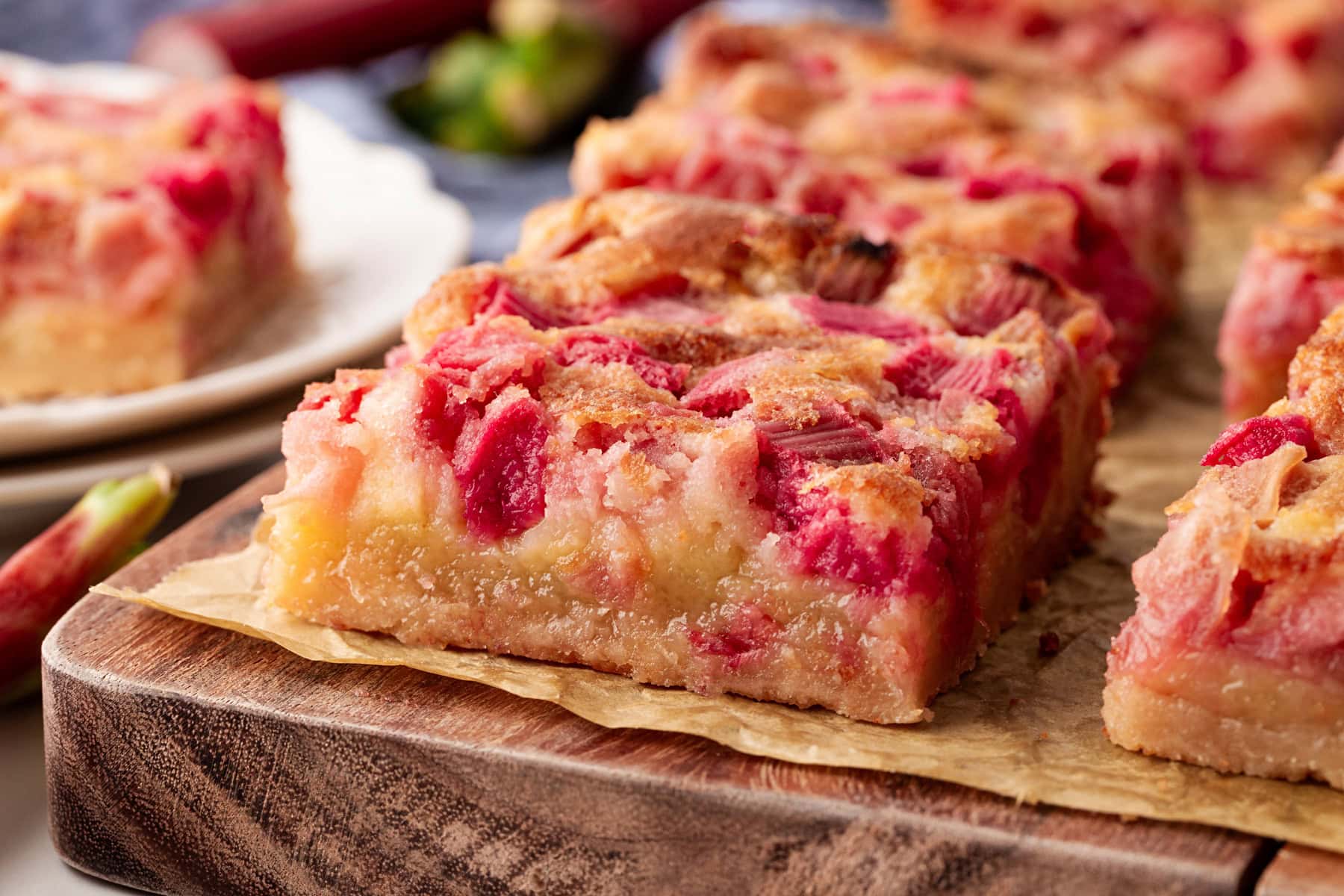 Rhubarb Dream Bars are the perfect rhubarb lover's treat! They are rich and gooey, tart and sweet and make for an exquisite dessert with little effort. Close-up to see filling.