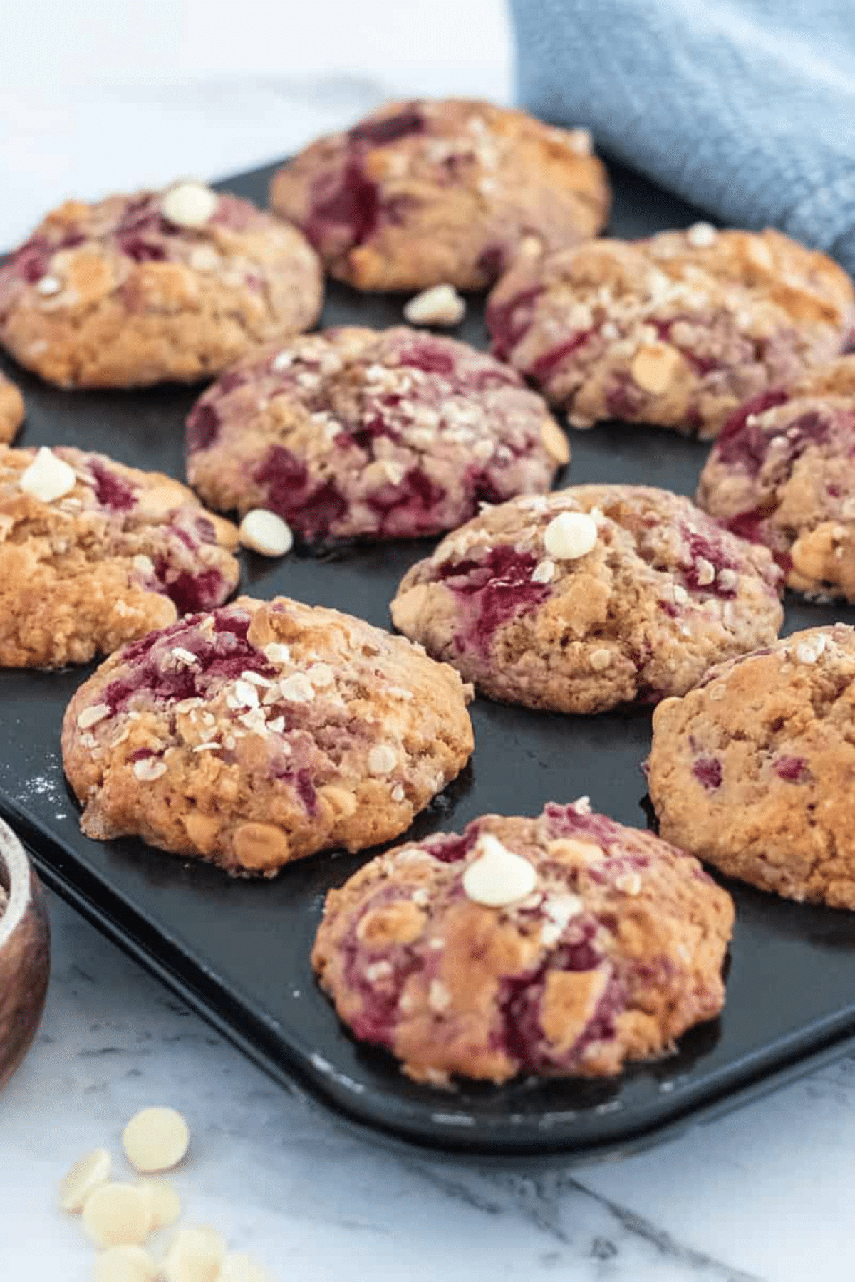 Raspberry Muffins in muffin tray.