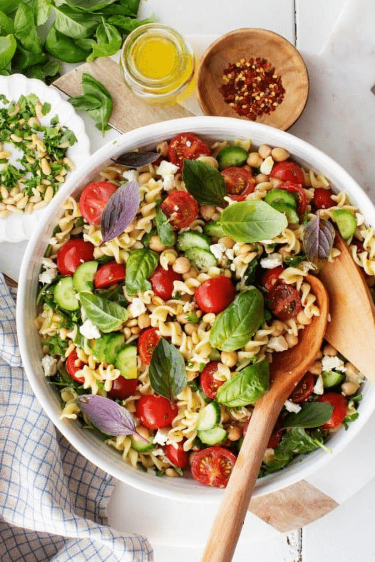 Pasta Salad from above in a white bowl with serving spoon.