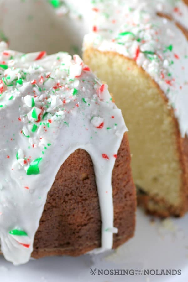 White Hot Chocolate Peppermint Bundt close up with a slice cut from the cake